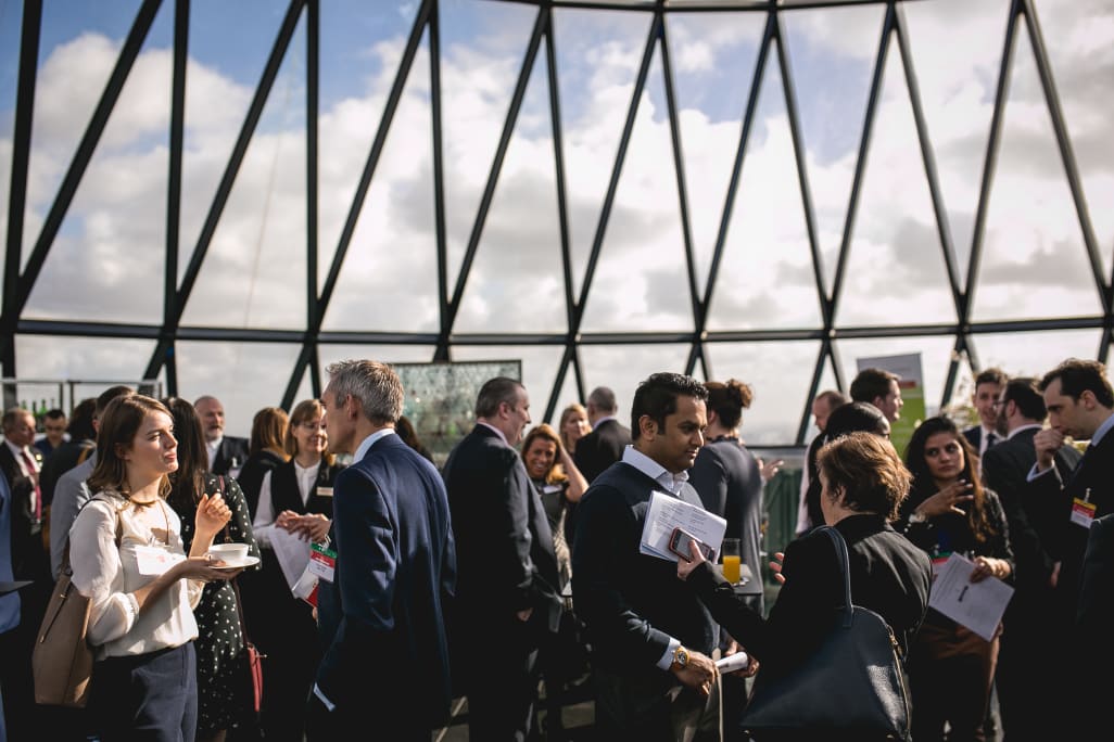 People networking at the Gherkin building