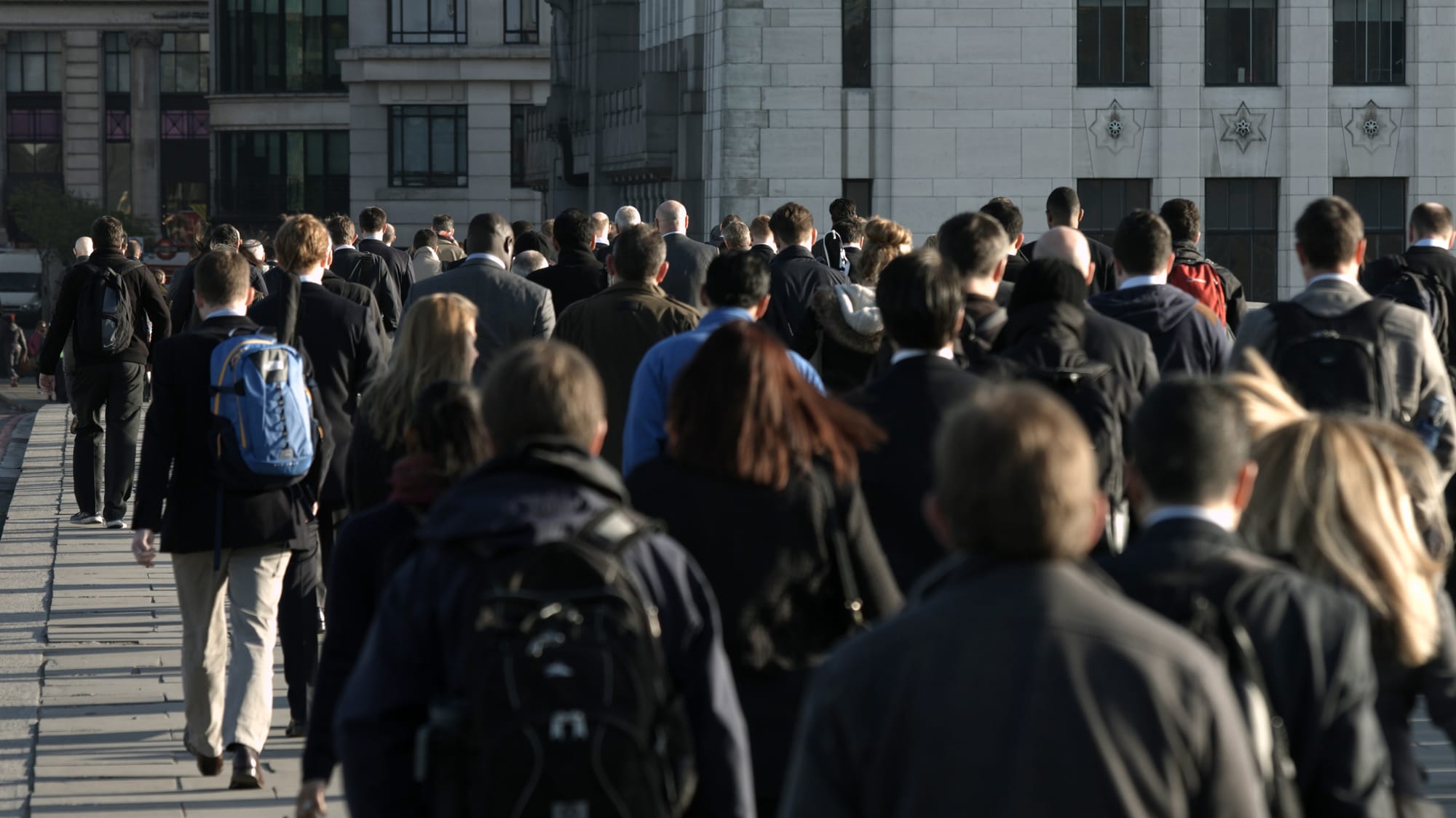 People commuting to work in London