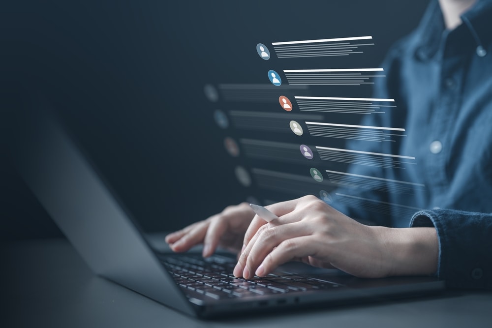 person scrolling data lists on a laptop