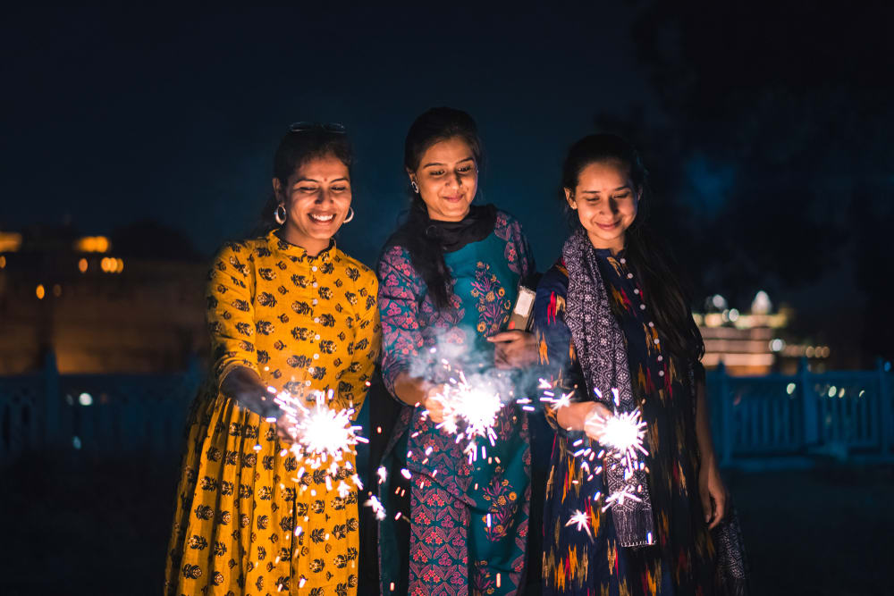3 women at the Diwali celebration
