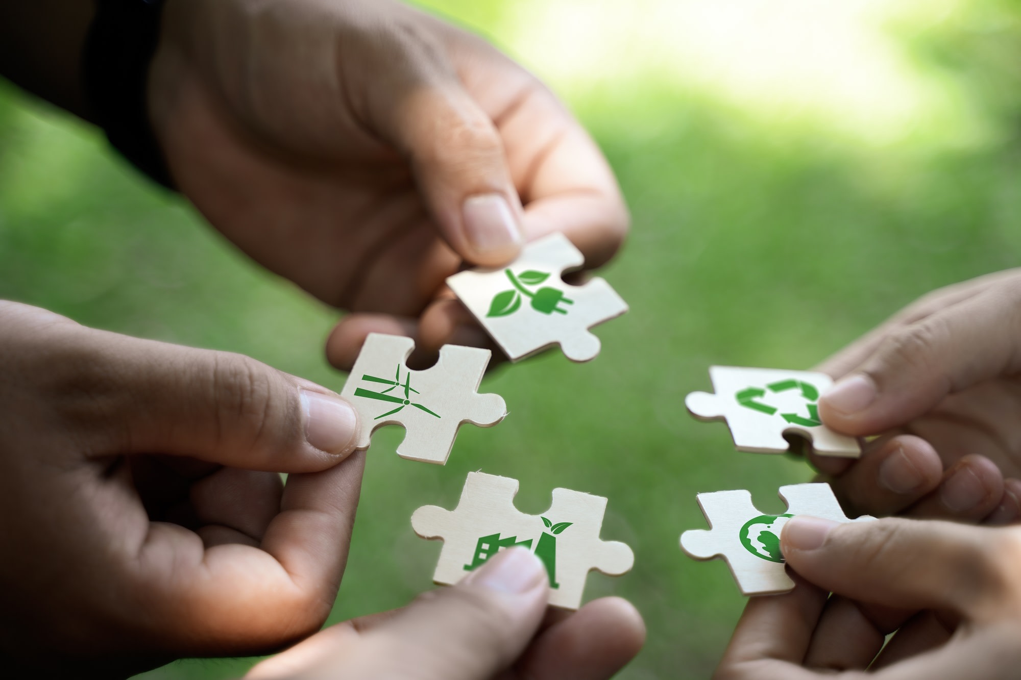 People holding puzzle pieces