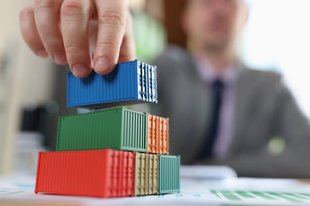 Man stacking containers models