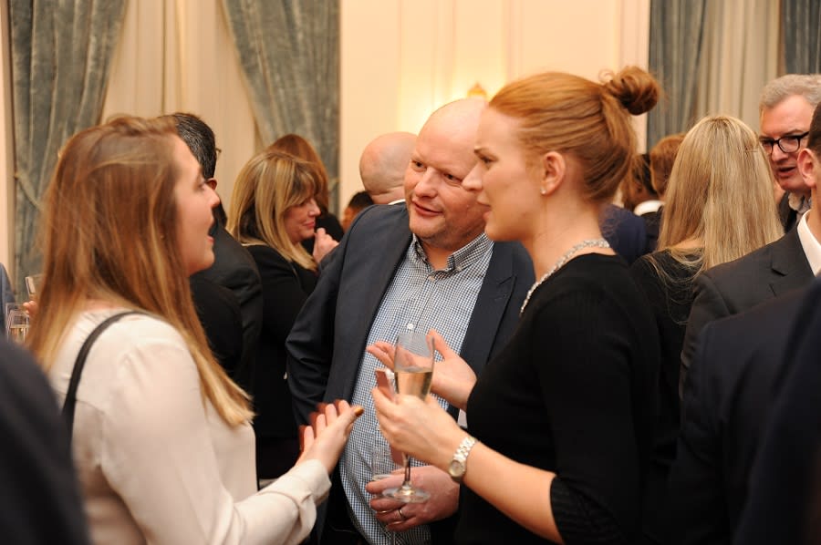Three people talking at a LCI Networking event