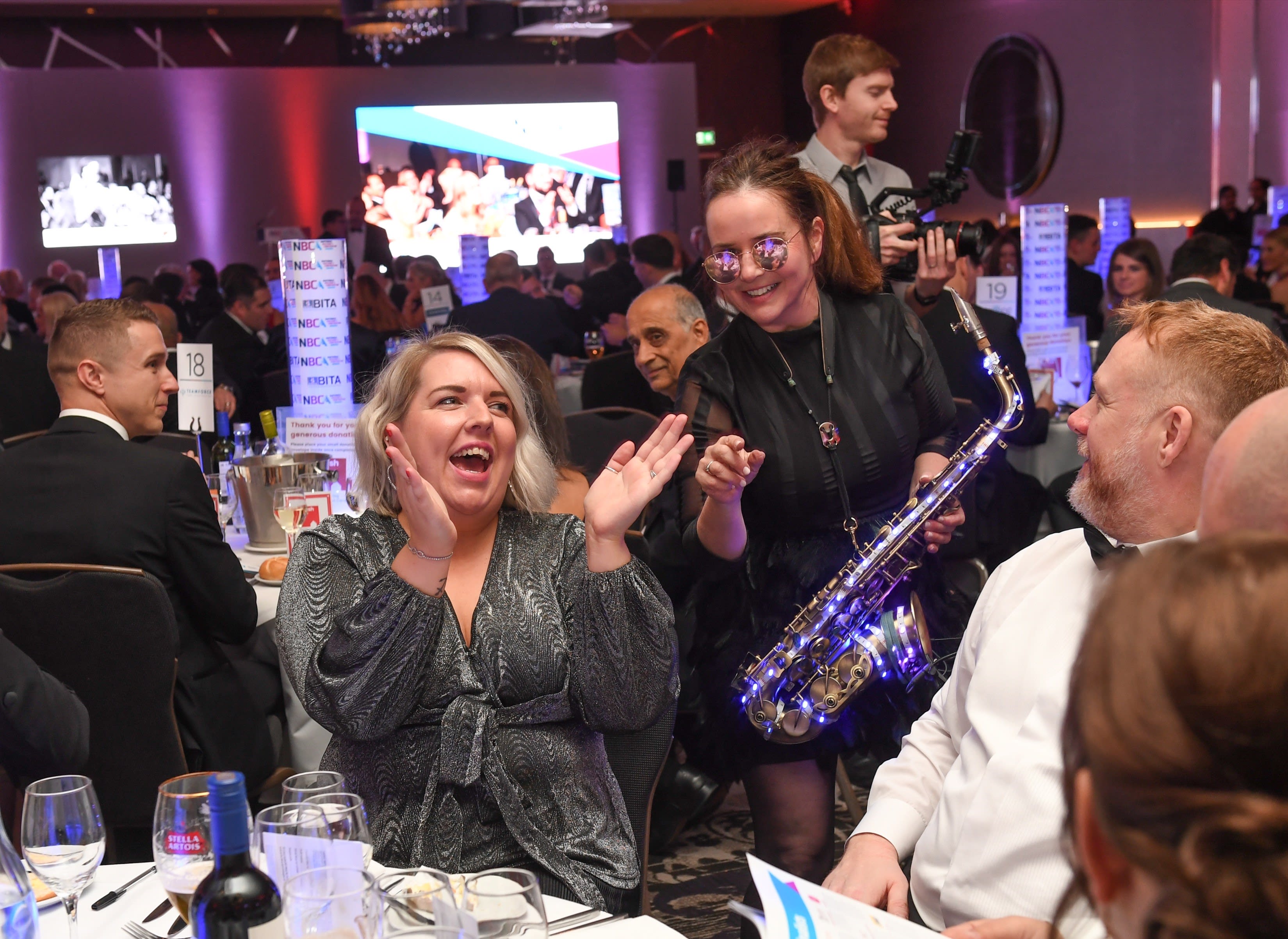 Guests enjoying entertainment at a table