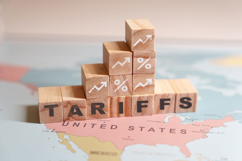 Wooden blocks spelling out 'tariffs', symbolizing the impact of economic policies on trade