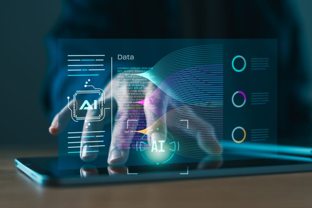 Hand typing on a tablet and Ai popping up
