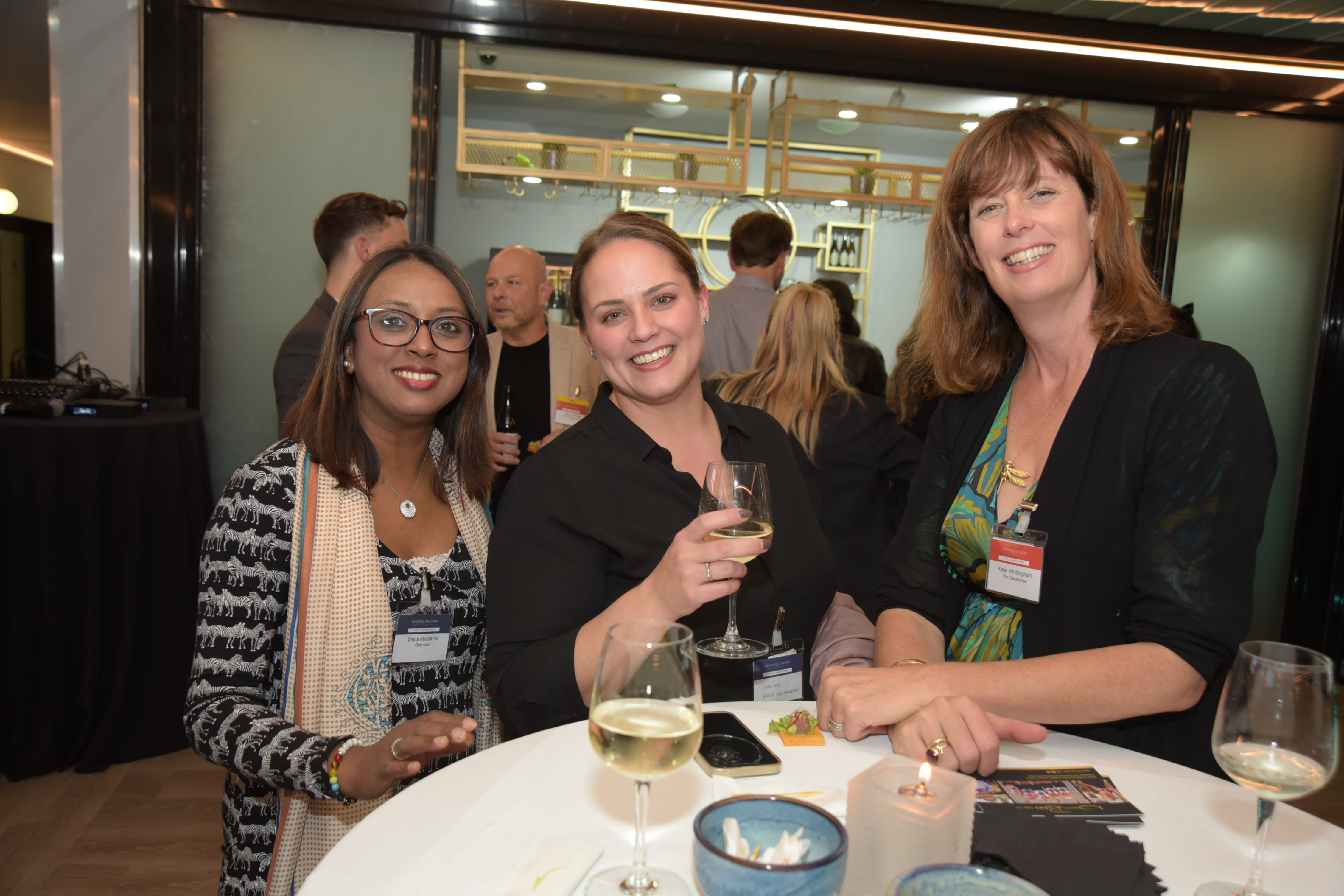 3 women at a networking event