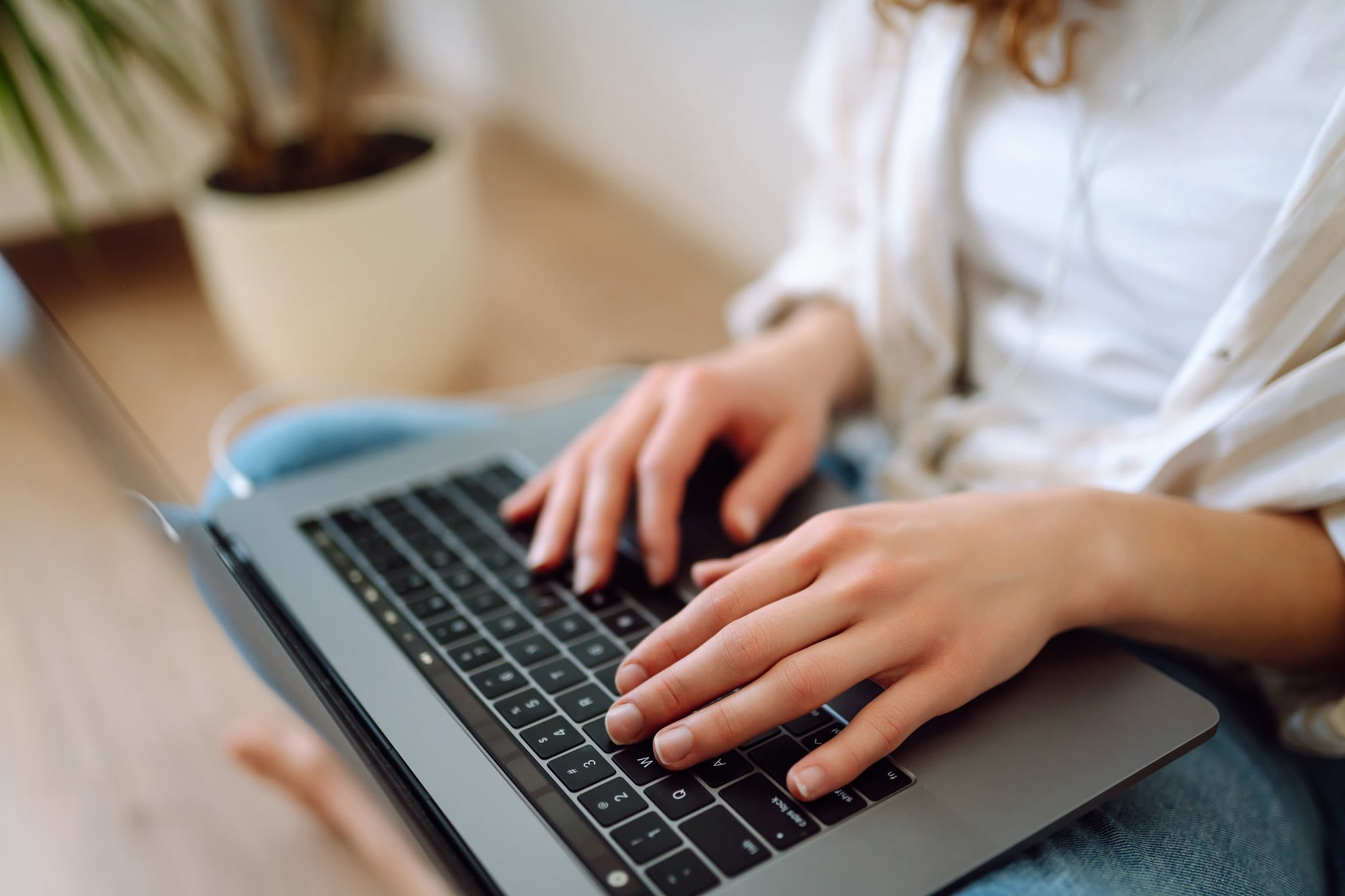 Woman typing a laptop