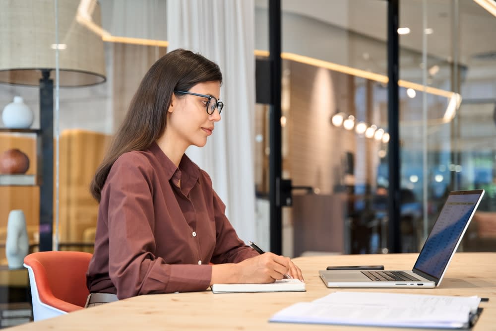 Woman watching a webinar in an office