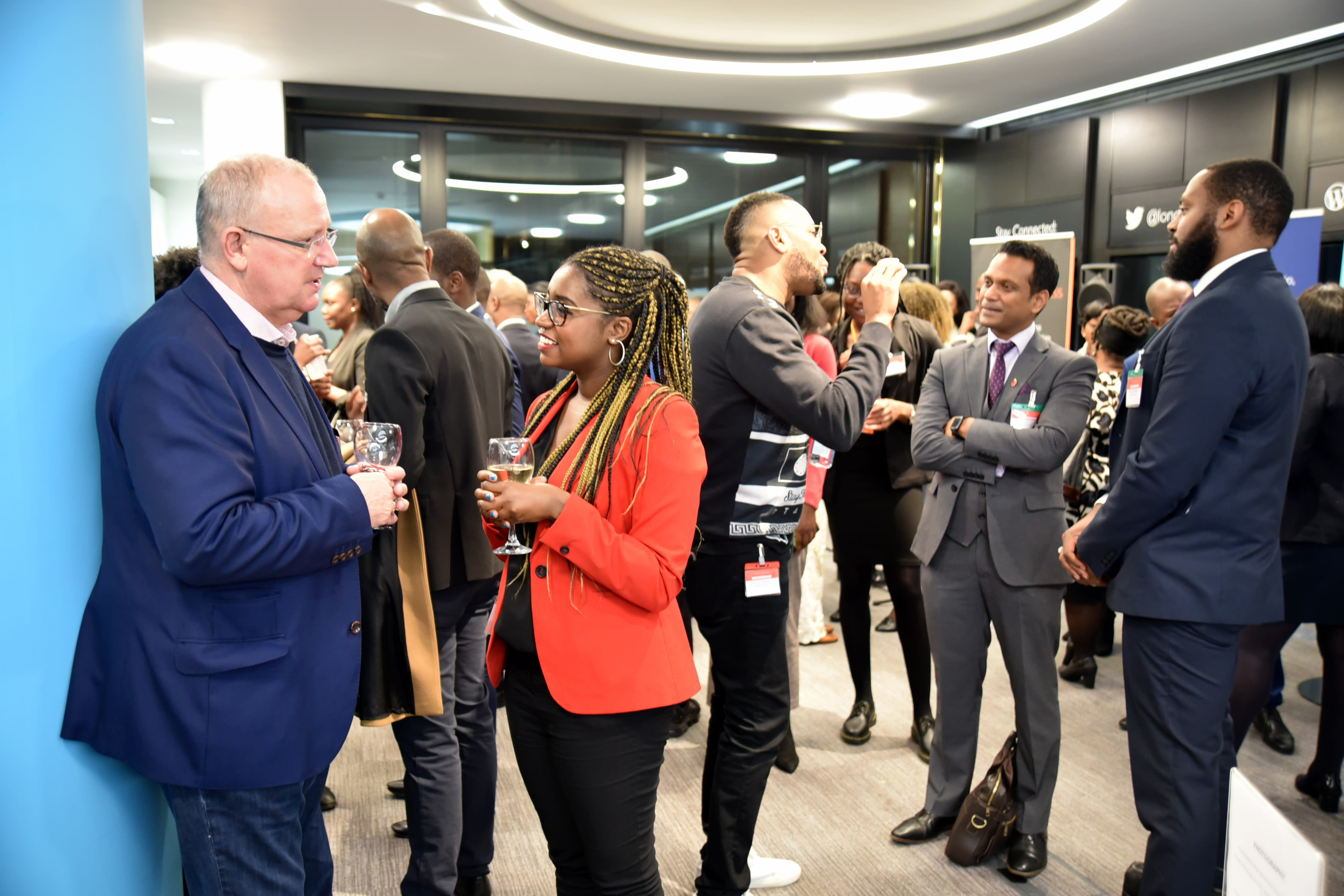 People networking in the members' lounge