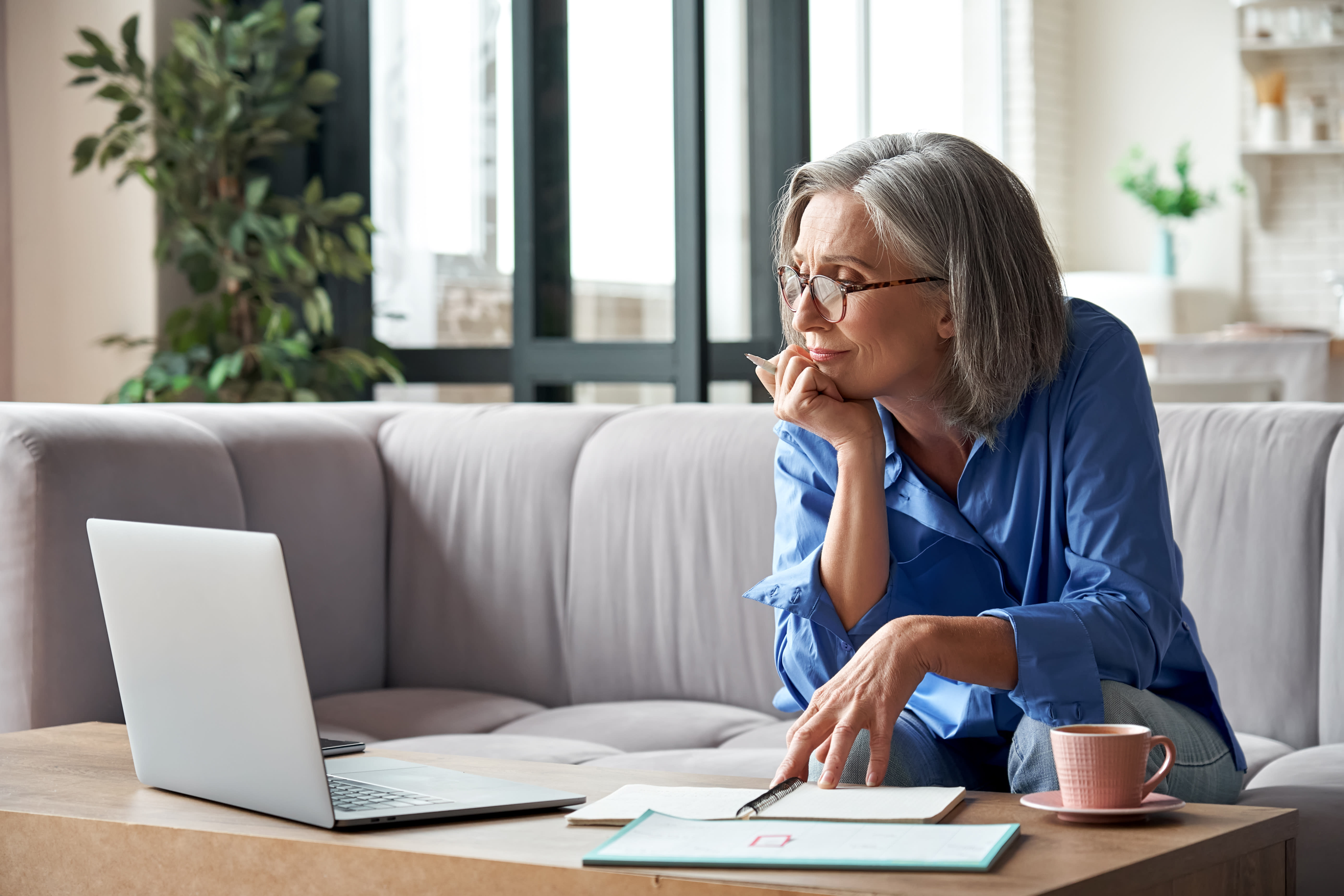 Woman looking at a laptop while working