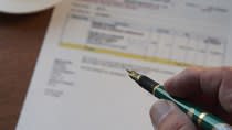 Export Document and a person holding a pen