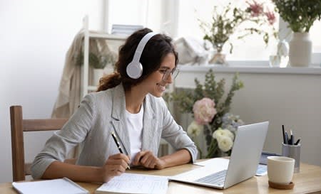 Woman looking a webinar