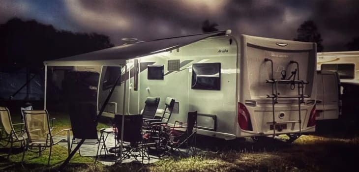 Nighttime Caravan Campsite Setup