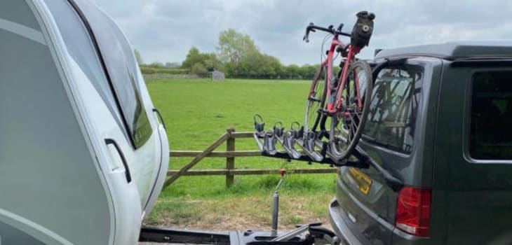 Caravan Hooked to Car with a Tow Bar