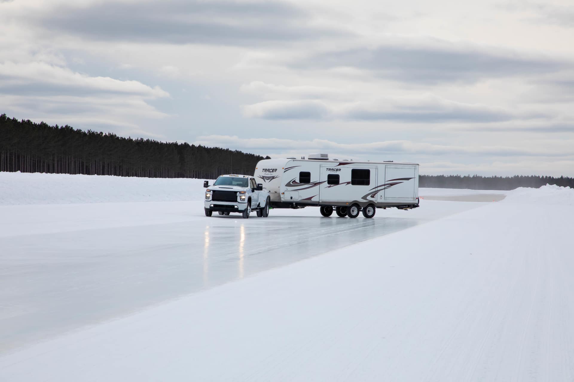 Truck pulling a travel trailer on ice