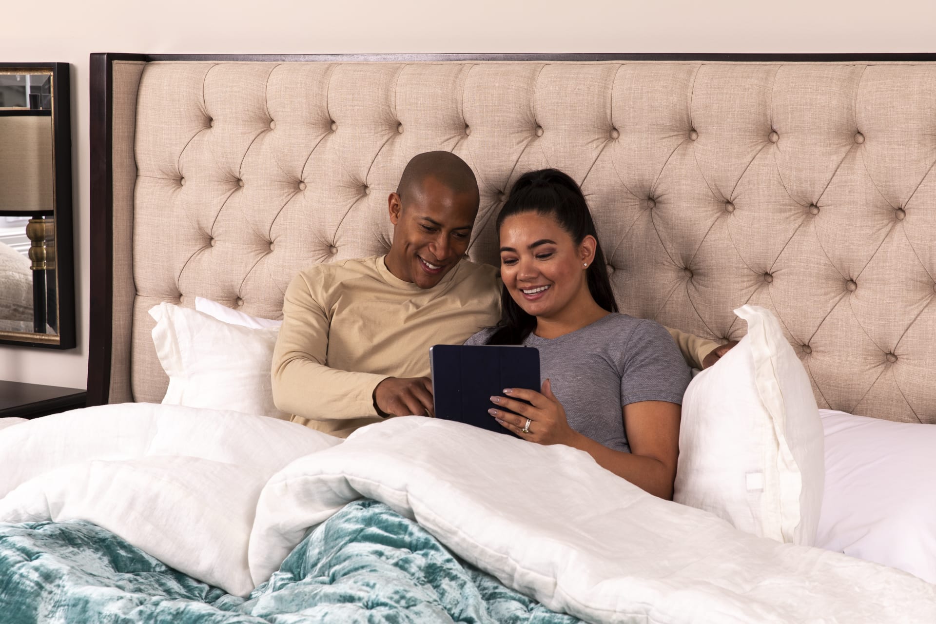 Hotel Mattress Couple Sitting on Bed