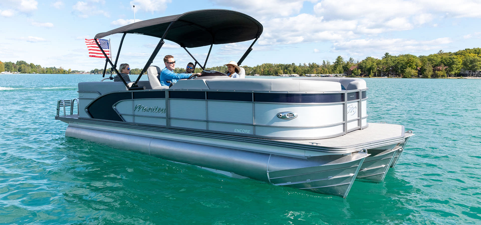 Pontoon Boat on Water with Bimini American Flag