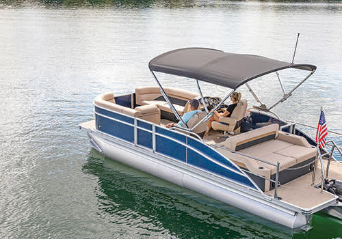 Pontoon Boat with Bimini Top on the Water