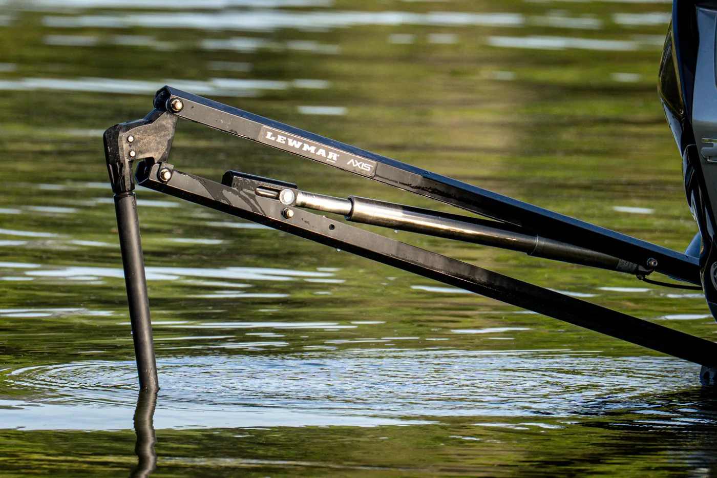 Lewmar ambassador Darold Gleason on his bass boat at first light, Lewmar Axis electric shallow water anchor mounted on the transom