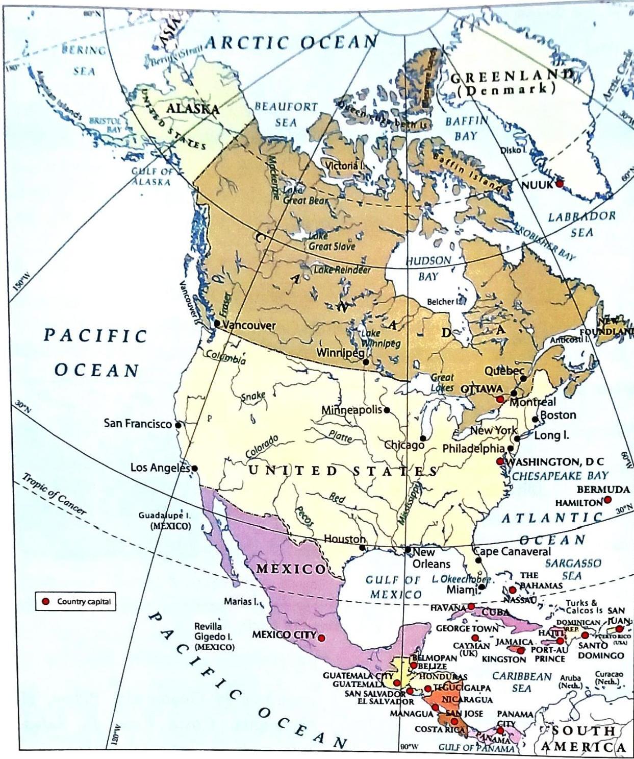 This map displays North America, Greenland, and parts of the Caribbean and Central America, bordered by the Pacific, Arctic, and Atlantic Oceans. Major countries shown include the United States, Canada, and Mexico, along with numerous island nations in the Caribbean. Prominent geographical features include the Great Lakes, Hudson Bay, and the Tropic of Cancer. Key cities like Washington D.C., Ottawa, Mexico City, Los Angeles, and New York are marked, with red dots indicating country capitals.