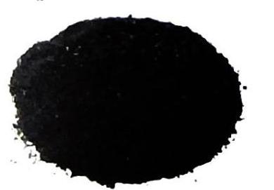 A pile of fine black powder against a white background.