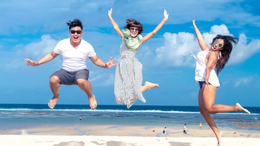 People jumping on the beach