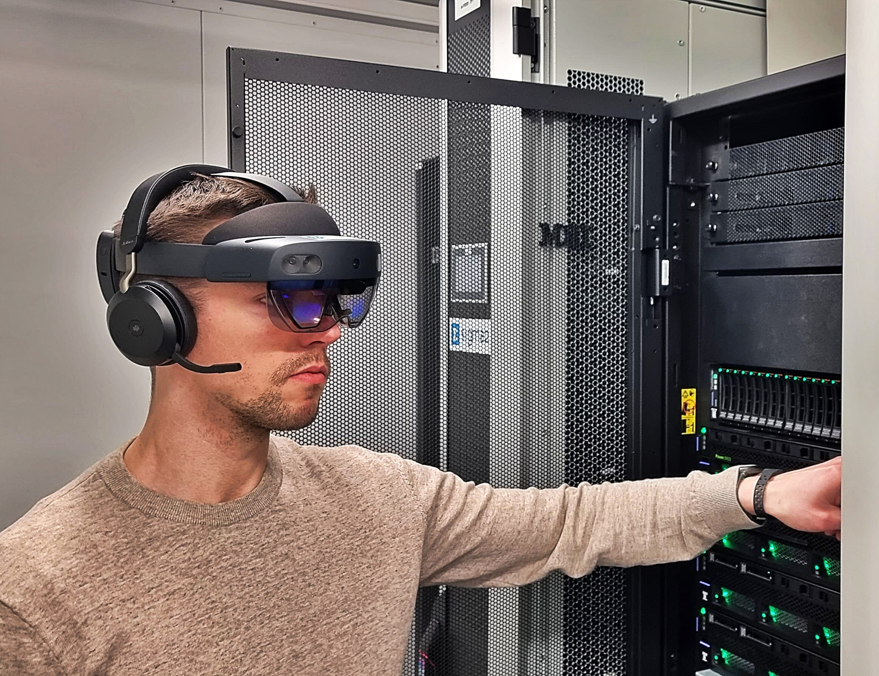 Technician in front of a supercomputer