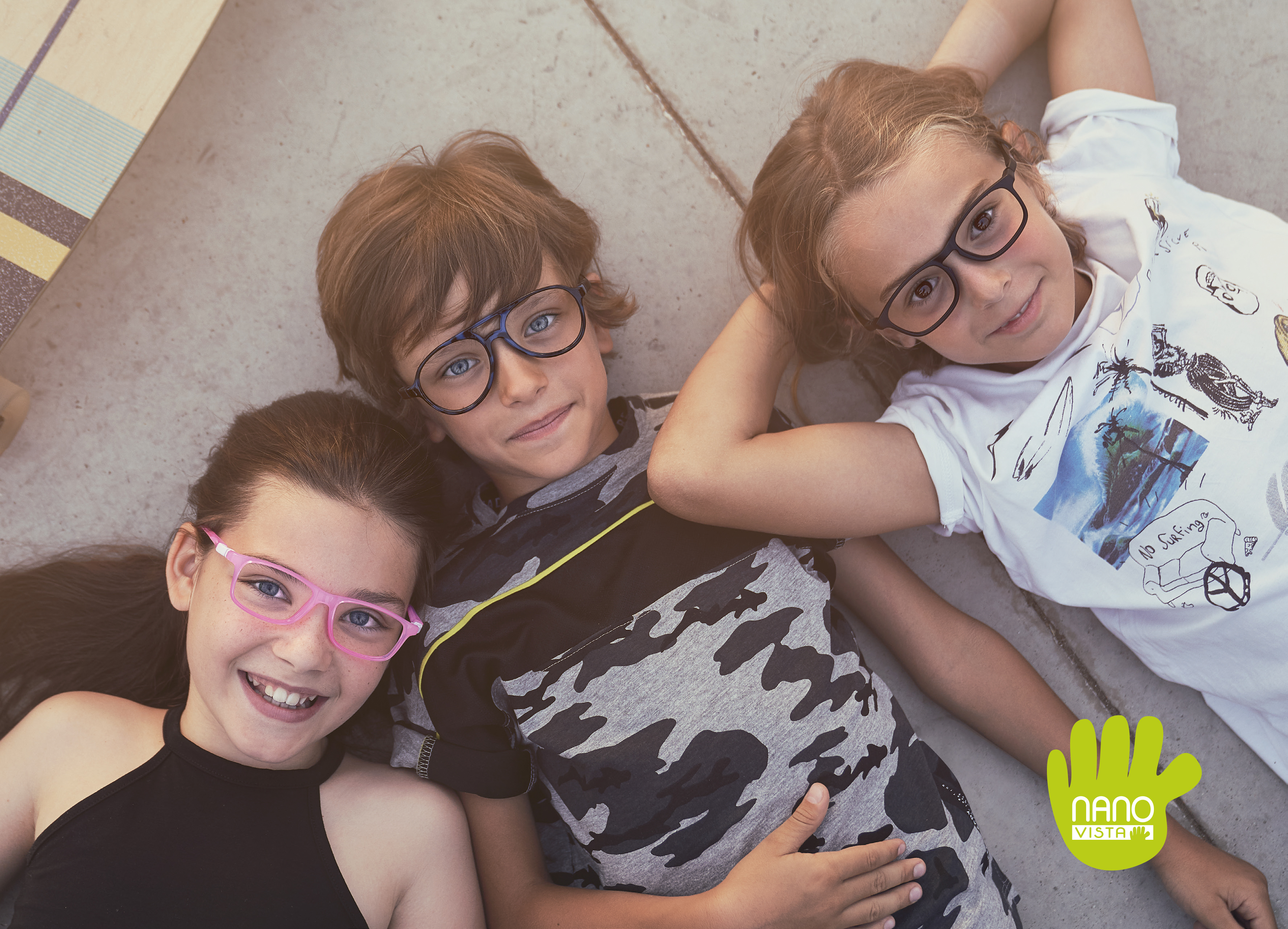 Nano Vista unbreakable frames for kids campaign poster with 3 kids wearing glasses and smiling.