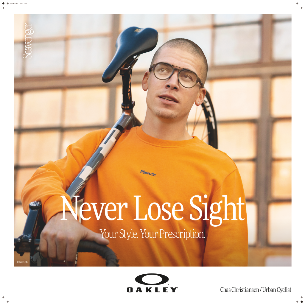 Never lose sight" Oakley poster featuring a man in an orange jumper, wearing glasses, and carrying a bike on his shoulders.