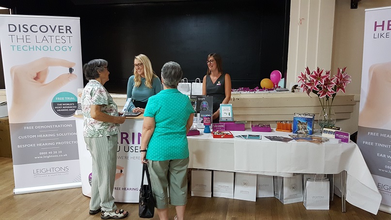 Visitors at the Open Sight fair stand.