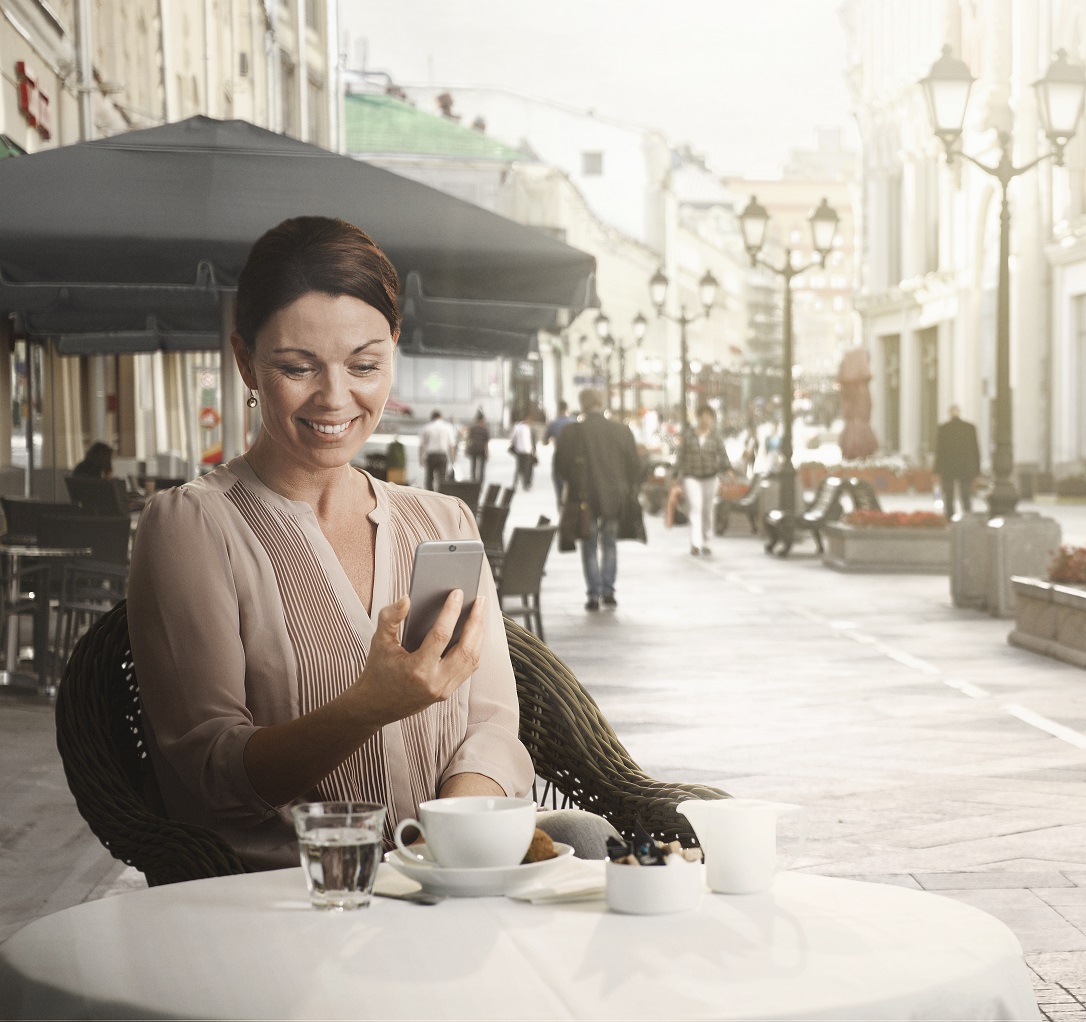 woman outside with smartphone