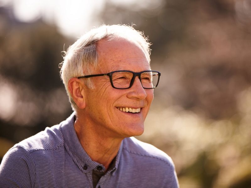 Man wearing glasses and smiling