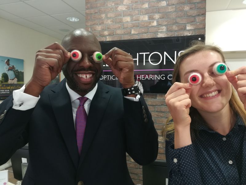 Leightons staff holding sweets shaped like eyeballs.