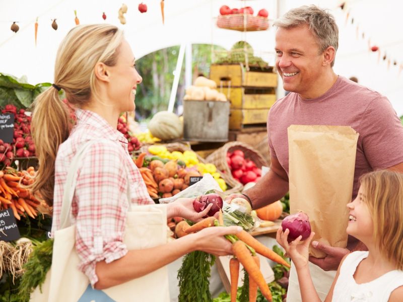 Family at fruit and vegetable market