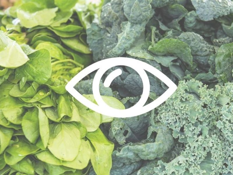 An eye icon superimposed on a green vegetables image.