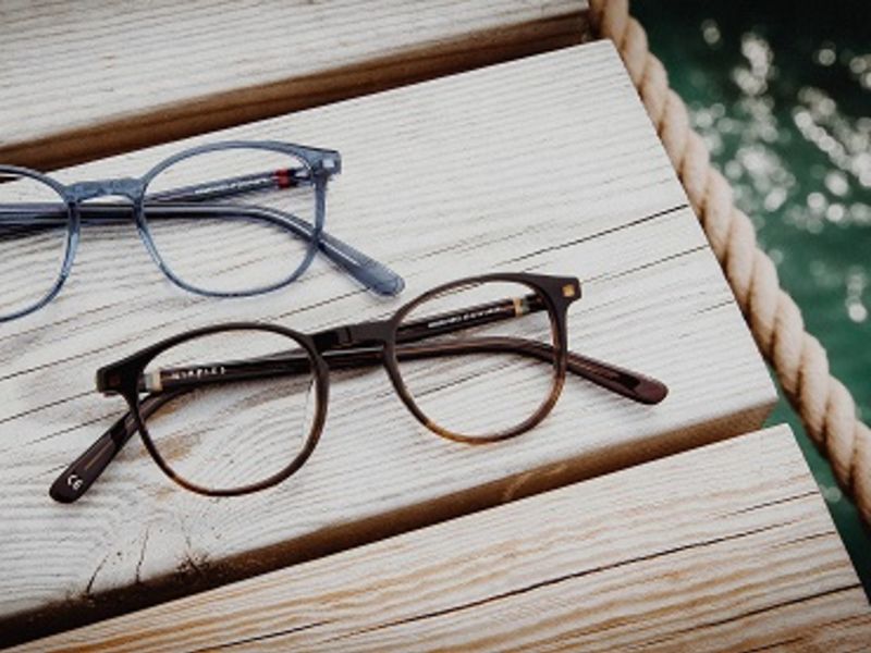 Two pairs of glasses on wood