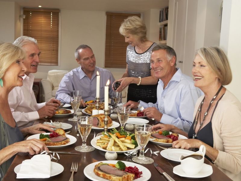 Family eating beef wellington round table