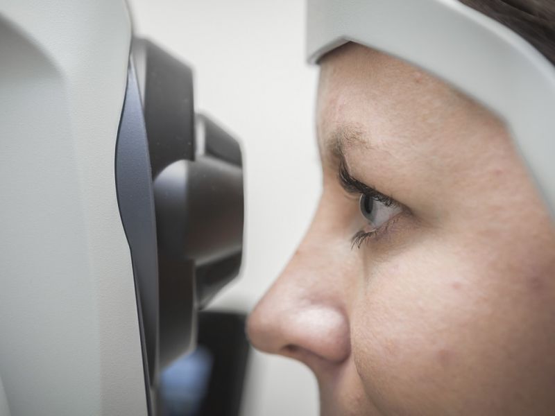 Woman having a digital eye photograph taken