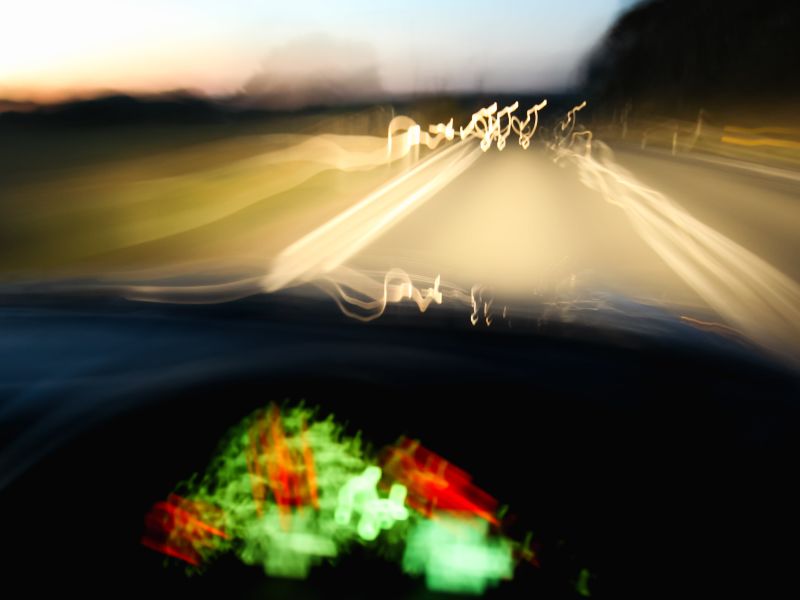 Blurry car dashboard on road