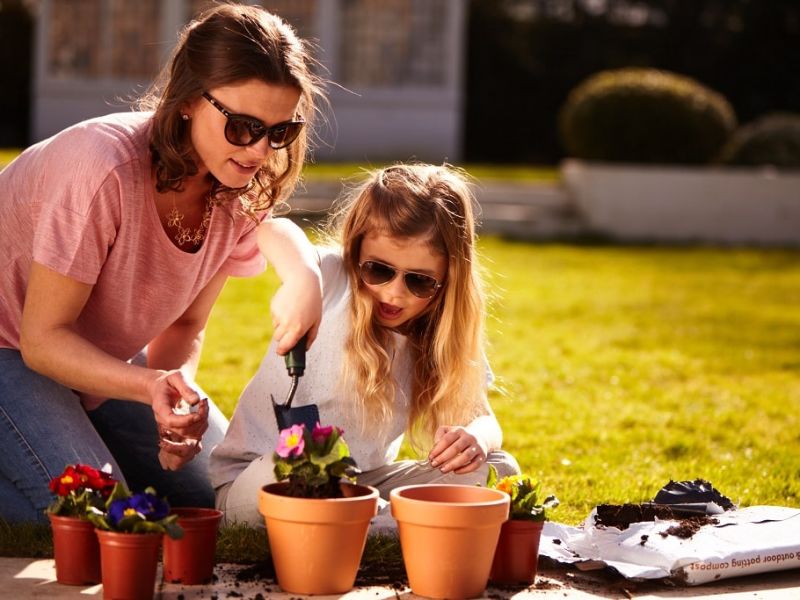 Woman and child gardening