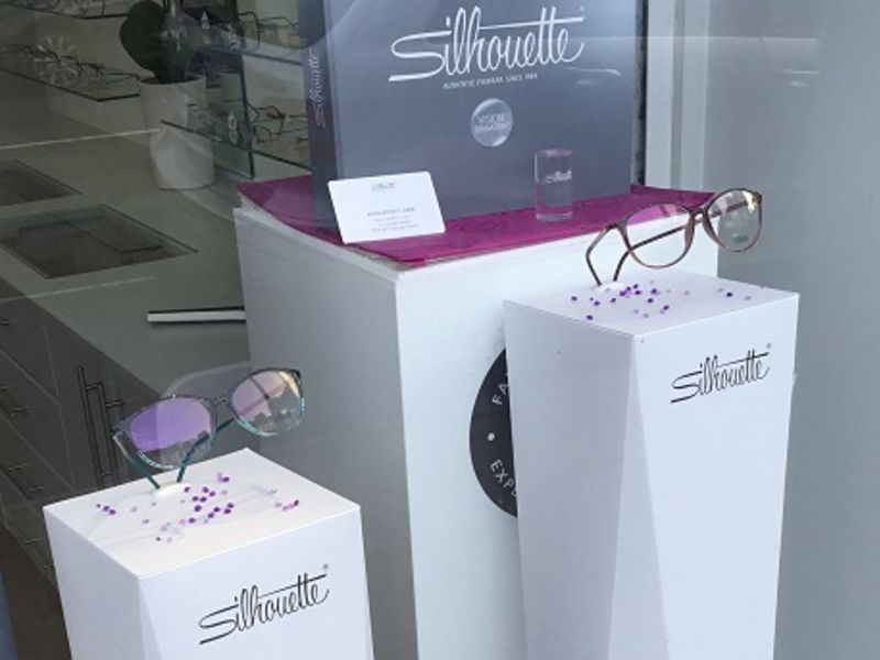 Silhouette glasses display in window