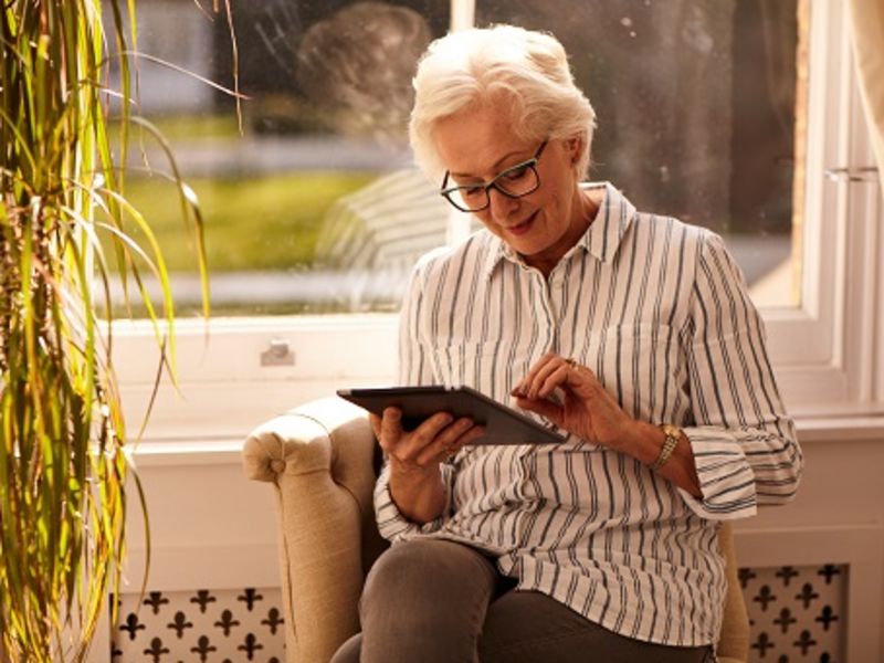 Woman sat down using Ipad