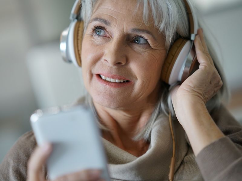 Woman wearing headphones listening to audio