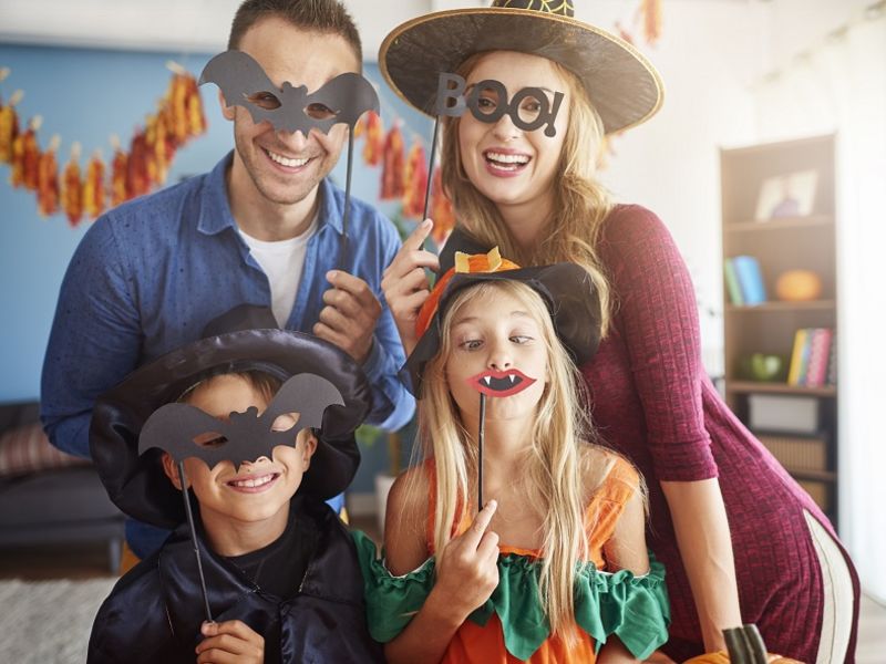 Family dressed up in Halloween costumes