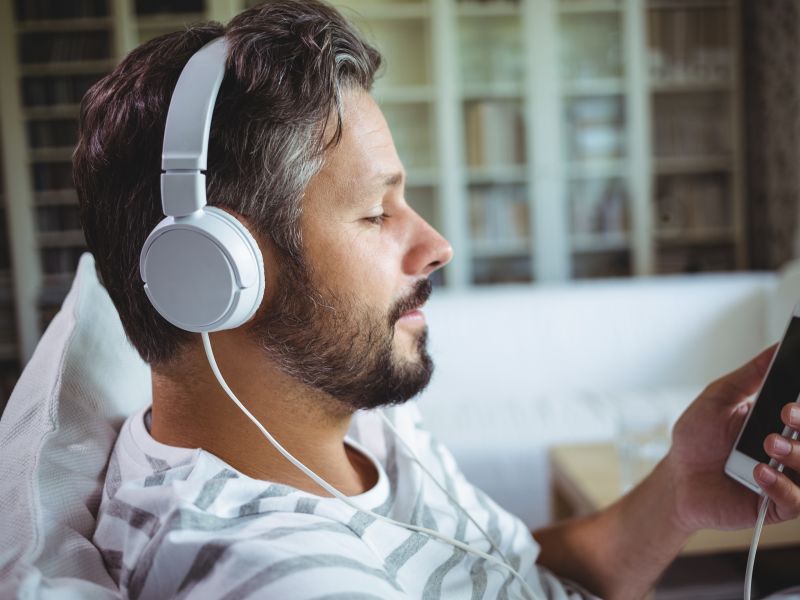 Man with headphones listening to audio