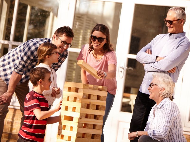 Three generation family playing Jenga