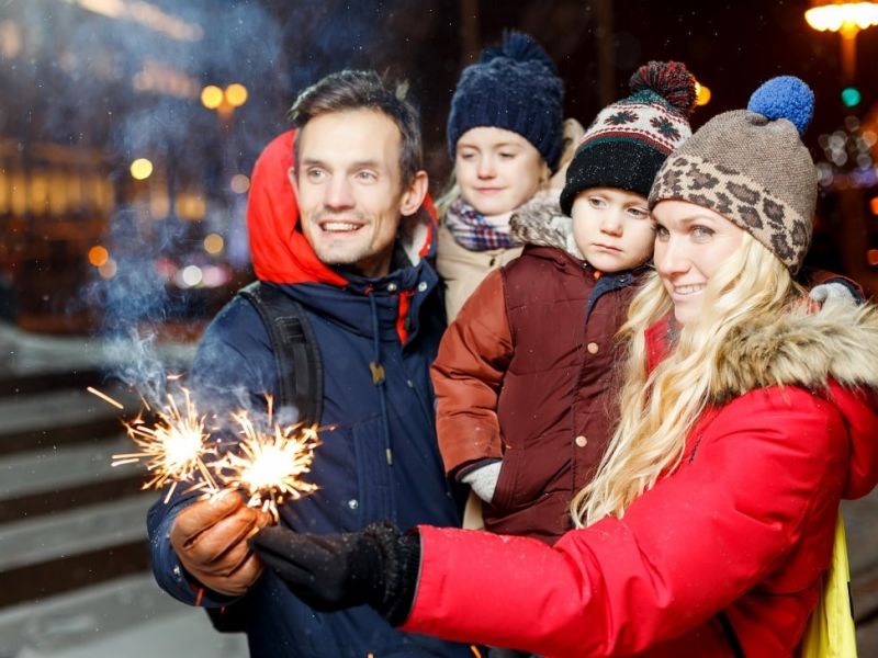 Family holding sparklers