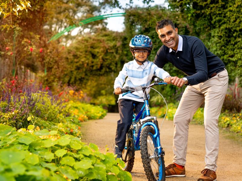 Father and son cycling in the countryside
