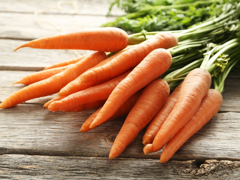 Carrots on wooden table